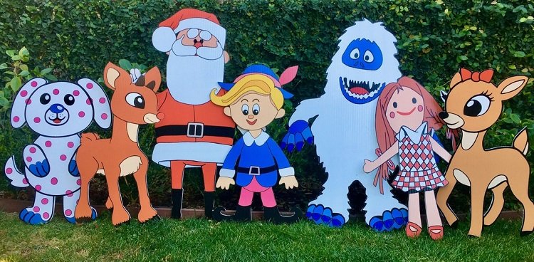 A collection of adorable wooden Christmas yard decorations.